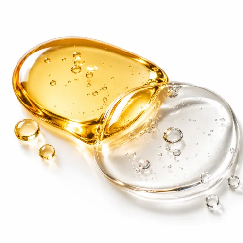 Gocce d'olio dorate e trasparenti